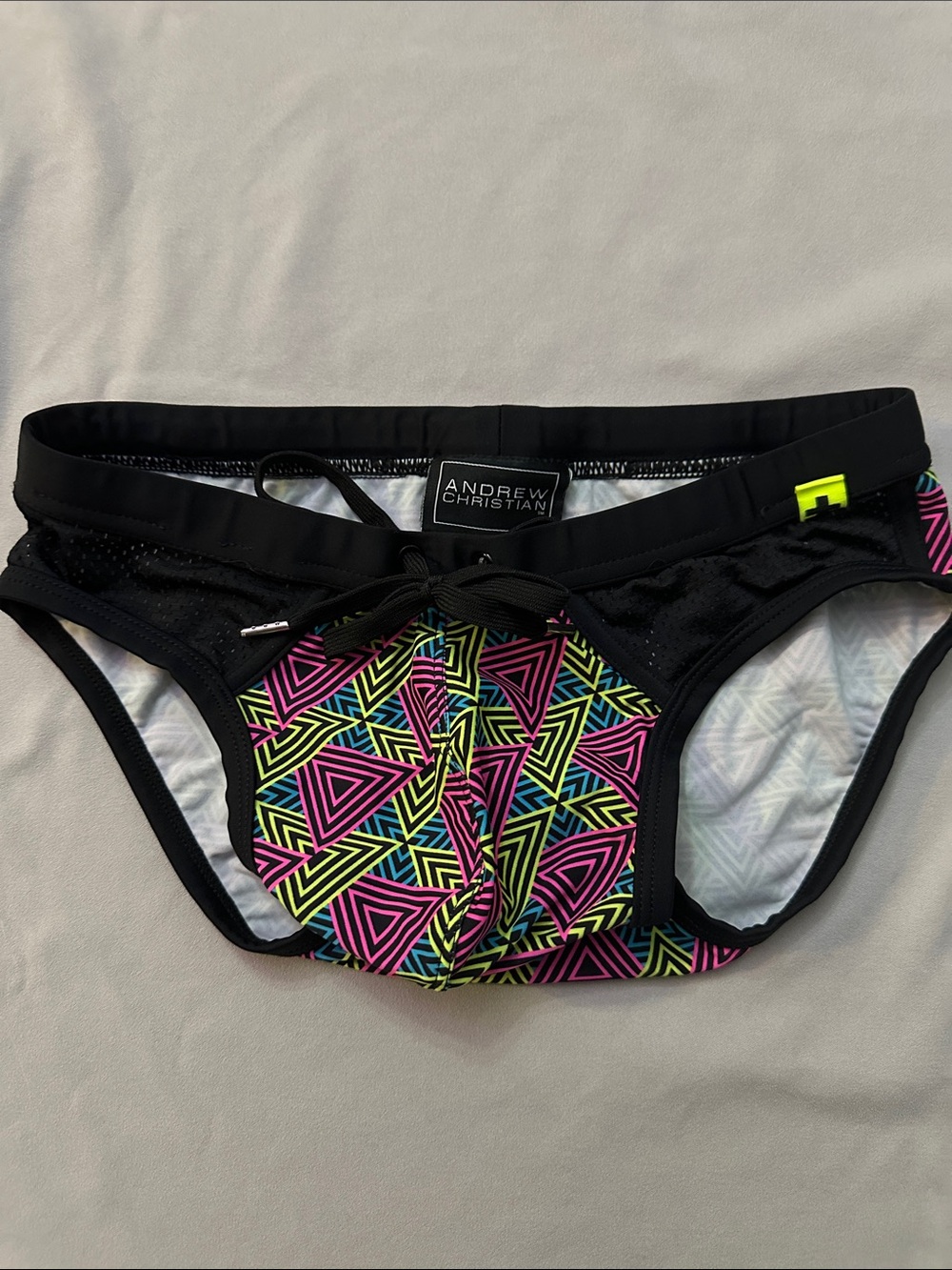 Andrew Christian Black Swim Briefs with Neon Pink, Yellow & Blue Geo Print